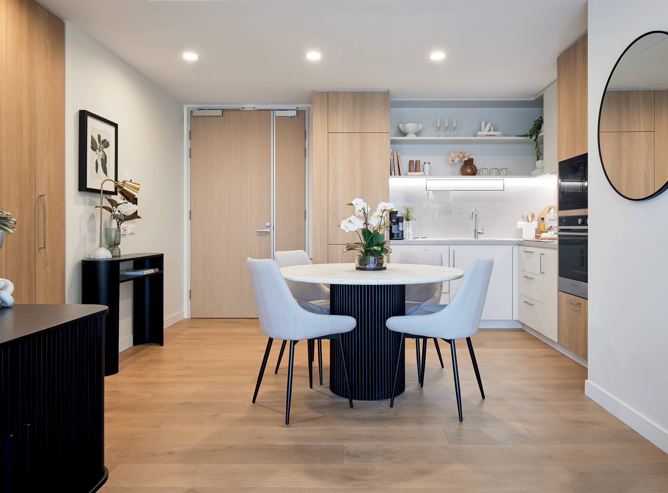 Kitchenette with premium appliances and modern finishes. 